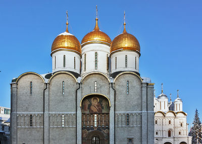 Low angle view of building against blue sky