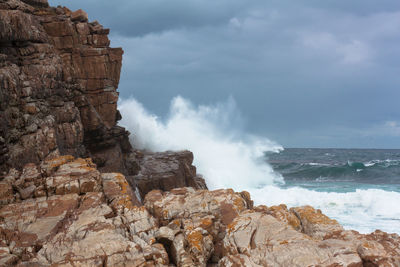 Waves splashing on rocks at beach