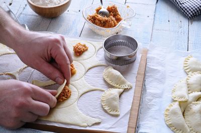 High angle view of person preparing food on table