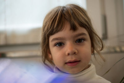 Portrait of cute girl at home