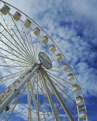 Low angle view of ferris wheel against sky