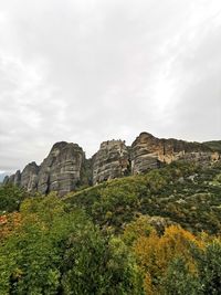 Low angle view of rock formations against sky