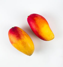 Close-up of fruit against white background