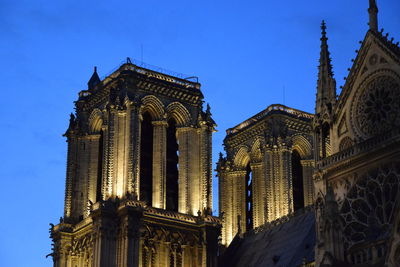 Low angle view of temple against clear blue sky