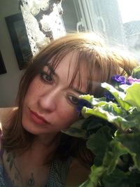 Portrait of woman with pink flowers