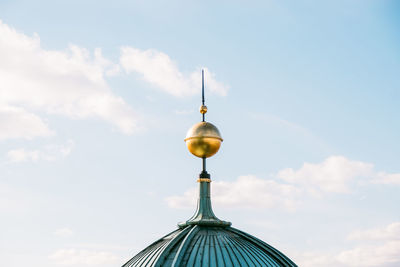 Low angle view of communications tower against sky