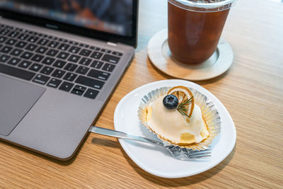 High angle view of coffee served on table