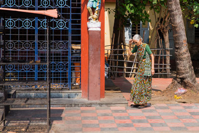 Man standing at entrance of building