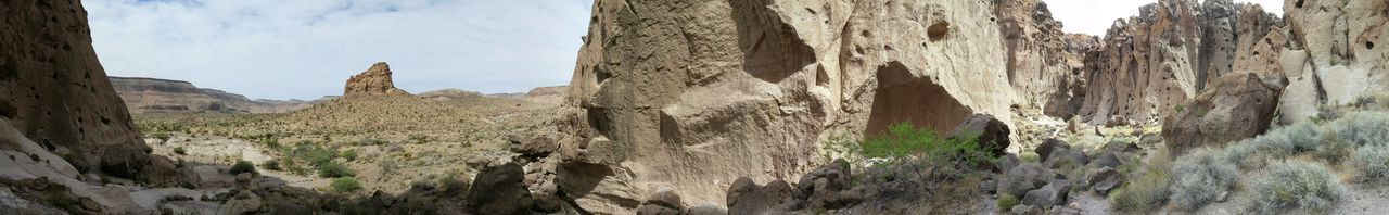 Panoramic view of rock formations against sky