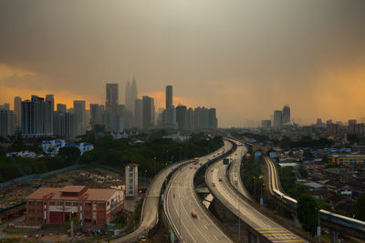 High angle view of cityscape against sky at sunset