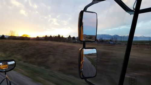 View of empty road against cloudy sky