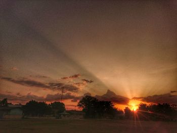 Scenic view of field against sky during sunset