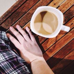 High angle view of coffee cup on table