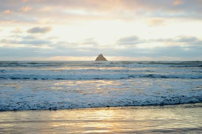 Scenic view of sea at sunset