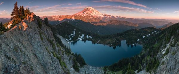 Panoramic view of snowcapped mountains against sky during sunset