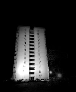 Low angle view of illuminated building at night