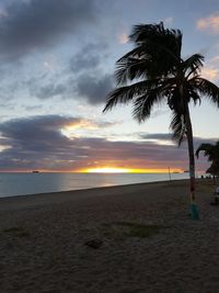 Scenic view of beach against sky during sunset