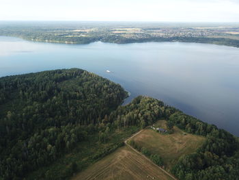 High angle view of land and sea against sky