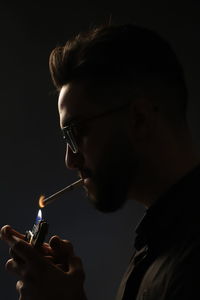 Close-up of man smoking cigarette