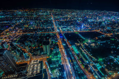 High angle view of illuminated buildings at night