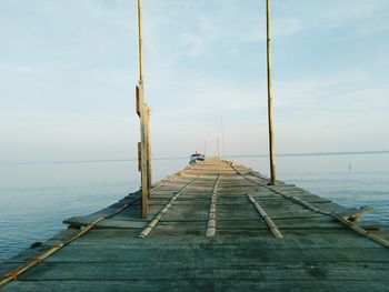 Pier over sea against sky