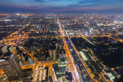 High angle view of illuminated city buildings at night