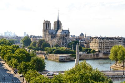 View of buildings in city against sky