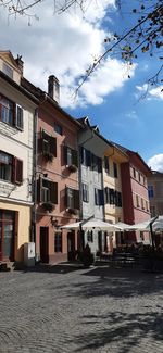 Low angle view of buildings in city against sky
