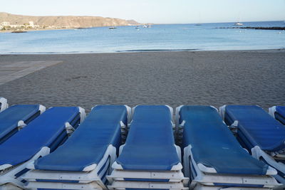 Scenic view of beach against blue sky