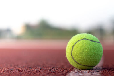 Close-up of tennis ball on court