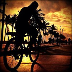 Silhouette of people at sunset