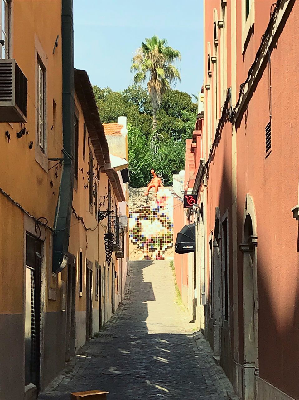 NARROW ALLEY ALONG BUILDINGS