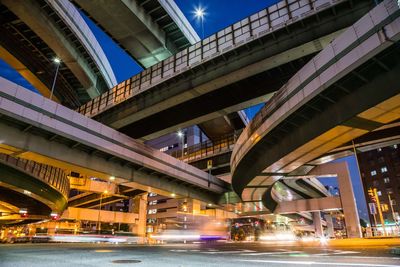 Low angle view of elevated road at night