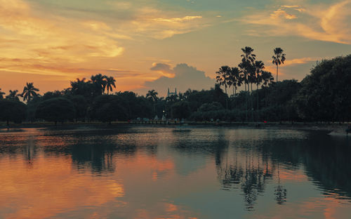 Scenic view of lake against sky during sunset