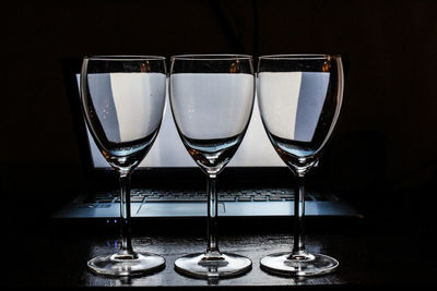 Close-up of wine glasses on table