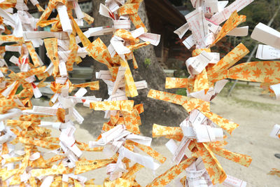 Full frame shot of patterned tied hanging outside temple