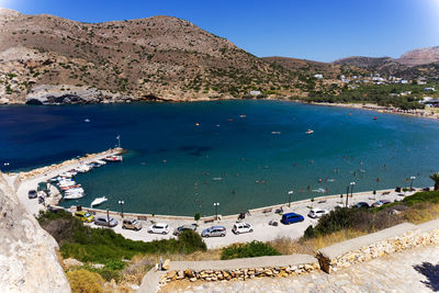 High angle view of sea and mountains against clear sky