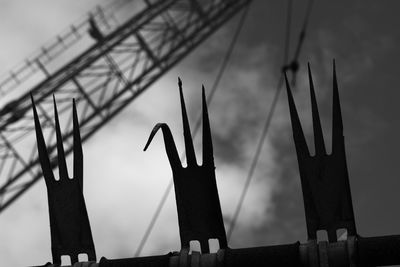 Close-up of power lines against sky