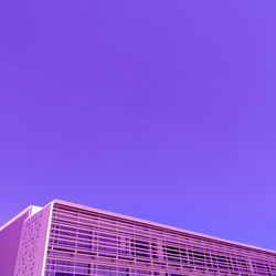 Low angle view of building against clear blue sky