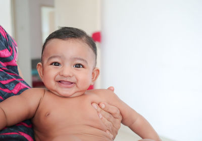 Portrait of cute baby girl at home