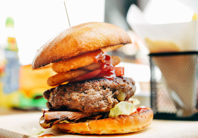 Close-up of fresh burger on table at restaurant