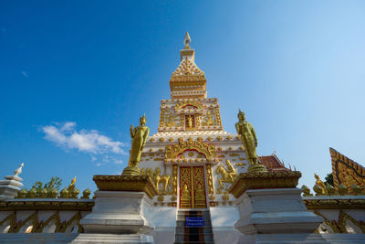 Low angle view of temple building against blue sky