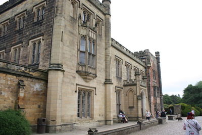 People in front of historical building