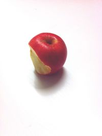 Close-up of red apple on white background