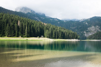 Scenic view of lake with mountains in background