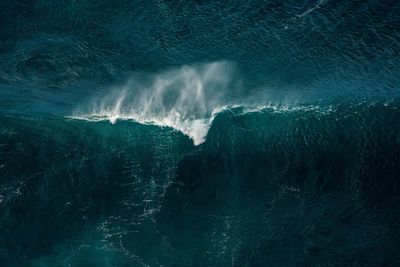 Aerial view of wave splashing in seascape