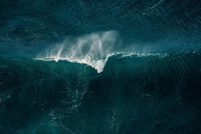 Aerial view of wave splashing in seascape