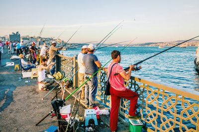 Young woman fishing in sea