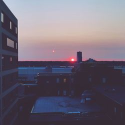 Cityscape against sky during sunset
