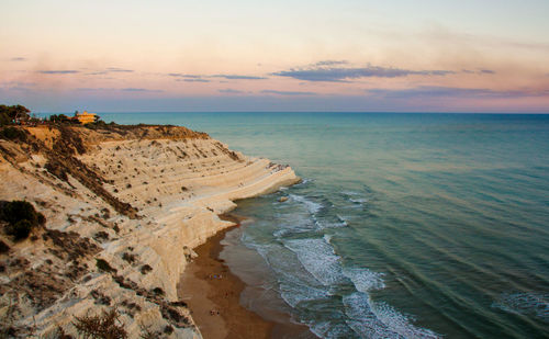 Scenic view of scala dei turchi beach against sky during golden hour sunset